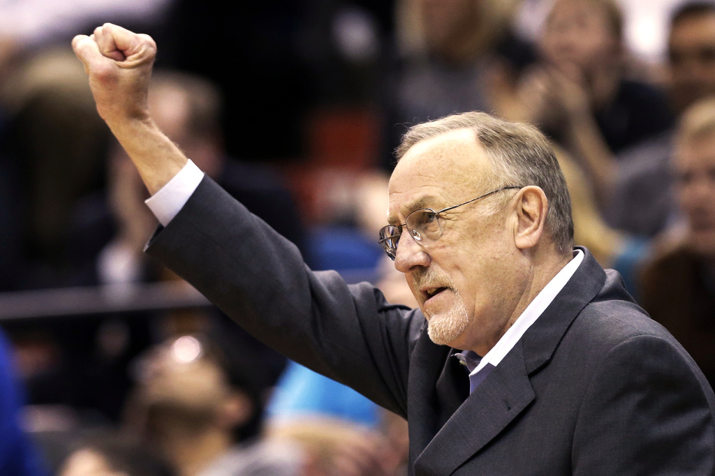 FILE - Minnesota Timberwolves head coach Rick Adelman celebrates a defensive rebound by Ricky Rubio in the second half of an NBA basketball game against Oklahoma City Thunder, March 29, 2013 ,in Minneapolis. (AP Photo/Jim Mone, File)