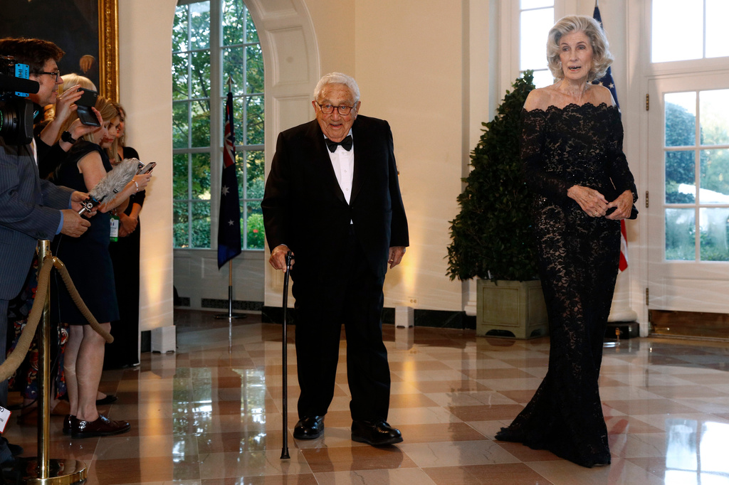 FILE - Former Secretary of State Henry Kissinger, left, and wife Nancy Kissinger arrive for a State Dinner with Australian Prime Minister Scott Morrison and President Donald Trump at the White House, Friday, Sept. 20, 2019, in Washington. (AP Photo/Patrick Semansky,File)