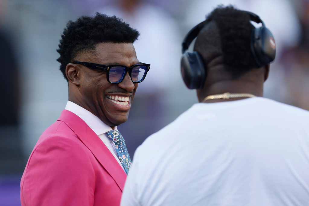 FILE -Former NFL quarterback and current sports commentator, Robert Griffin III, on the field before an NCAA football game between Colorado and TCU on Oct. 4, 2025, in Fort Worth, Texas. (AP Photo/Mike Buscher), File)