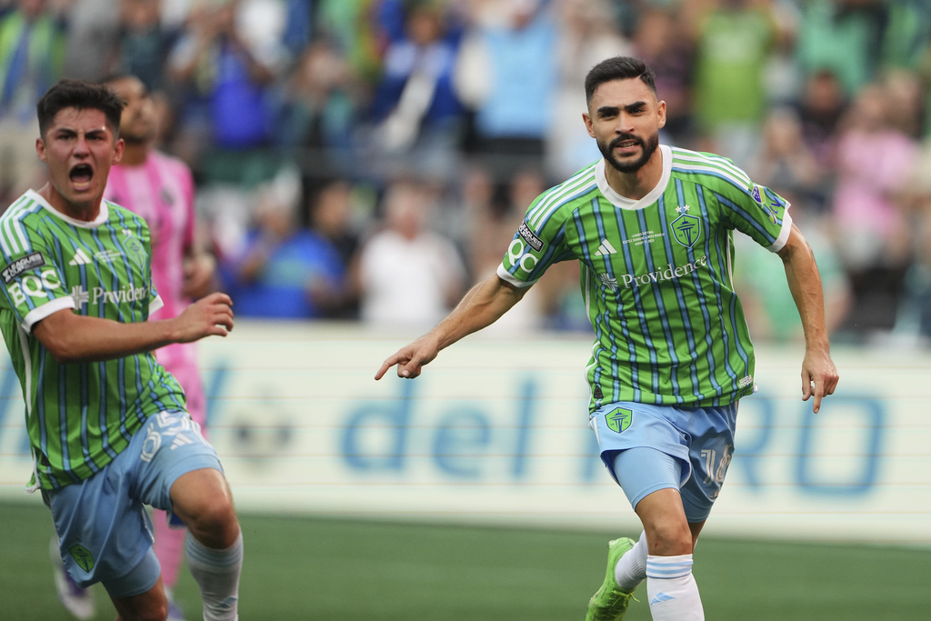 Seattle Sounders midfielder Alex Roldan, right, celebrates scoring on a penalty kick against Inter Miami as teammate Kalani Kossa-Rienzi, left, joins him during the second half of a Leagues Cup final soccer match Sunday, Aug. 31, 2025, in Seattle. (AP Photo/Lindsey Wasson)