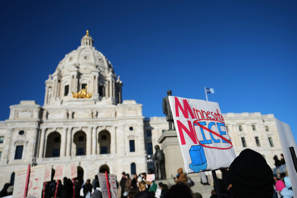 Protesters gather in front of the Minnesota State Capitol in response to the death of Renee Good, who was fatally shot by an ICE officer last week, Wednesday, Jan. 14, 2026, in St. Paul, Minn. (AP Photo/Abbie Parr)