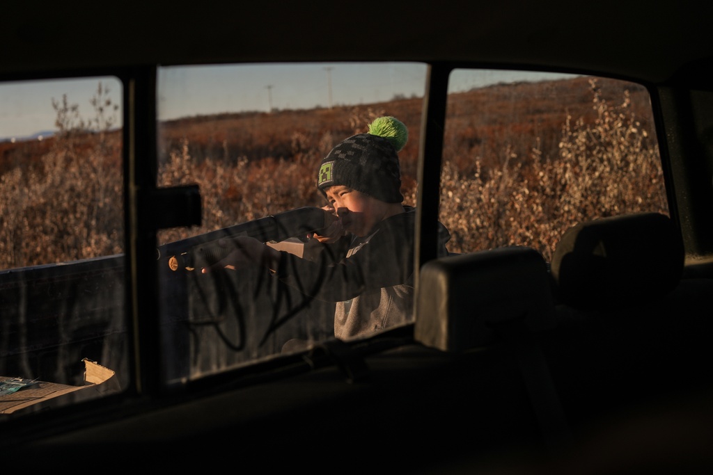 James Schaeffer, 7, hunts in Kotzebue, Alaska, Friday, Sept. 26, 2025. (AP Photo/Annika Hammerschlag)