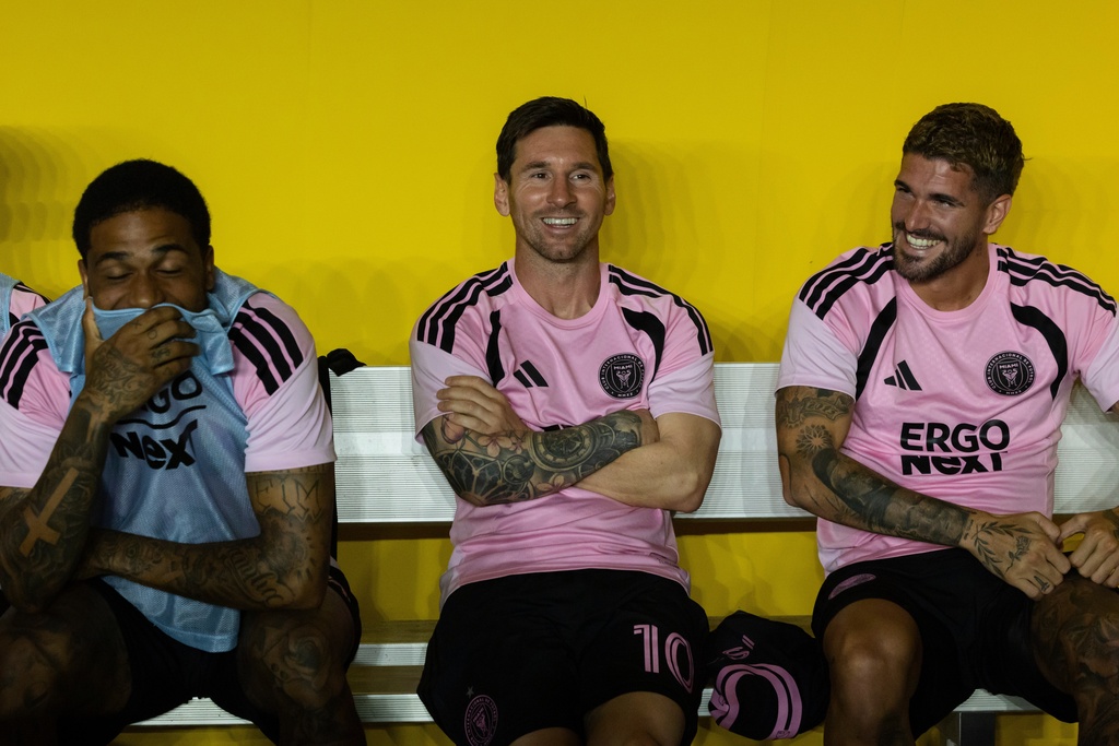Lionel Messi, center, Micael Dos Santos Silva, left, and Rodrigo de Paul of Inter Miami are seen during warmups before their international friendly soccer match against Ecuador's Independiente del Valle in Bayamon, Puerto Rico, Thursday, Feb. 26, 2026. (AP Photo/Alejandro Granadillo)