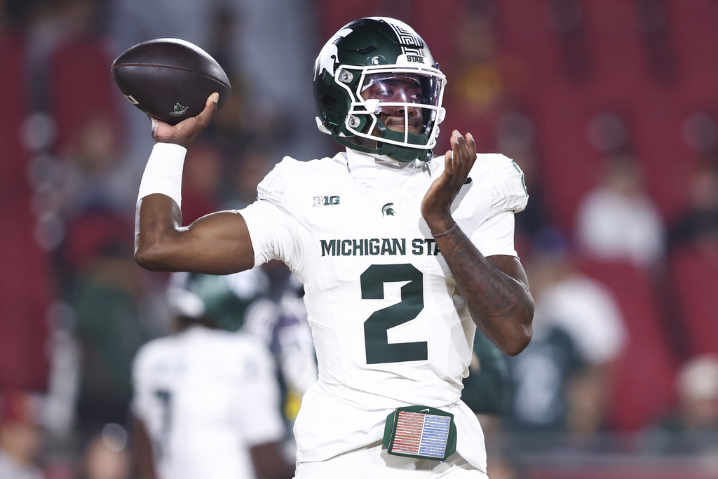 Michigan State quarterback Aidan Chiles warms up before an NCAA college football game against Southern California, Saturday, Sept. 20, 2025, Los Angeles. (AP Photo/Jessie Alcheh)