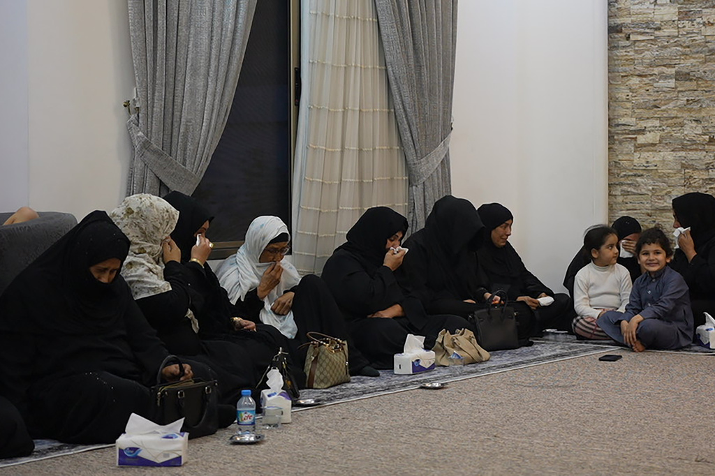 Women sit in quiet grief at the family home of Iraqi singer Sajida Obaid during the seventh-day mourning gathering in Irbil, Iraq, Thursday, April 10, 2026. (AP Photo/Stella Martany)