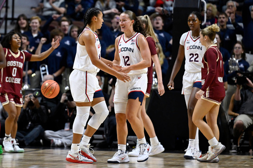 UConn guard Ashlynn Shade (12) reacts toward UConn guard Azzi Fudd in the first half of an exhibition NCAA college basketball game against Boston College, Monday, Oct. 13, 2025, in Uncasville, Conn. (AP Photo/Jessica Hill) UConn guard Ashlynn Shade (12) reacts toward UConn guard Azzi Fudd in the first half of an exhibition NCAA college basketball game against Boston College, Monday, Oct. 13, 2025, in Uncasville, Conn. (AP Photo/Jessica Hill)