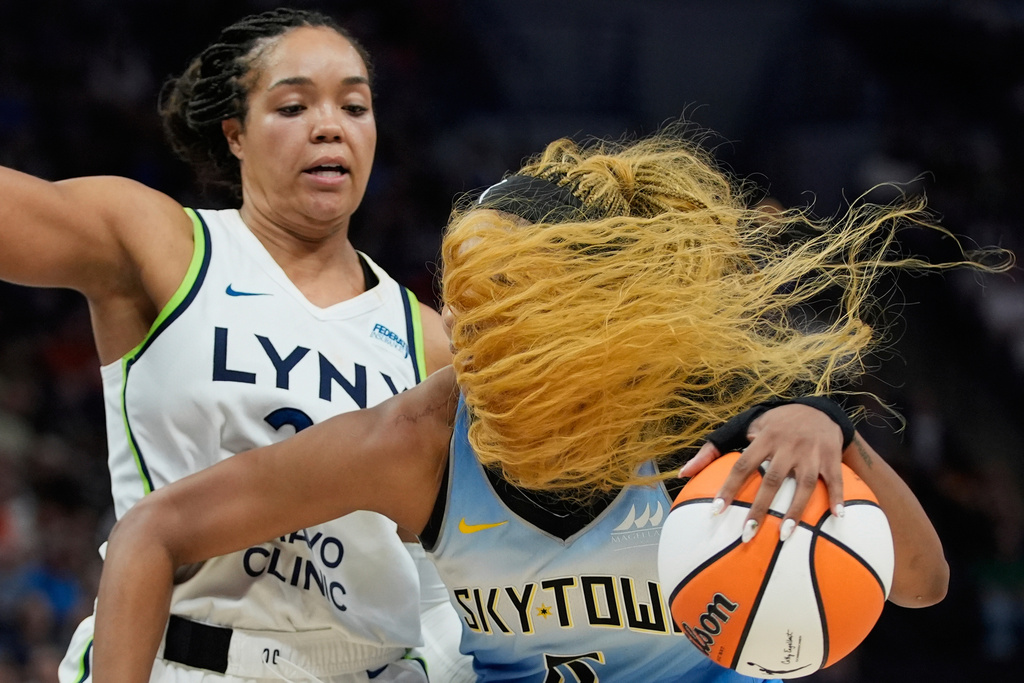 Chicago Sky forward Angel Reese, right, works toward the basket as Minnesota Lynx forward Napheesa Collier defends during the second half of a WNBA basketball game , July 22, 2025, in Minneapolis. (AP Photo/Abbie Parr, File)
