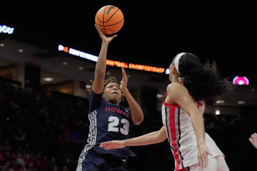 Howard guard Zoe Stewart (23) shoots against Ohio State in the second half in the first round of the NCAA college basketball tournament, Saturday, March 21, 2026, in Columbus, Ohio. (AP Photo/Sue Ogrocki)