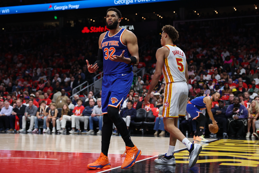 New York Knicks center Karl-Anthony Towns (32) reacts during the first half in Game 3 of a first-round NBA playoffs basketball series against the Atlanta Hawks, Thursday, April 23, 2026, in Atlanta. (AP Photo/Colin Hubbard)