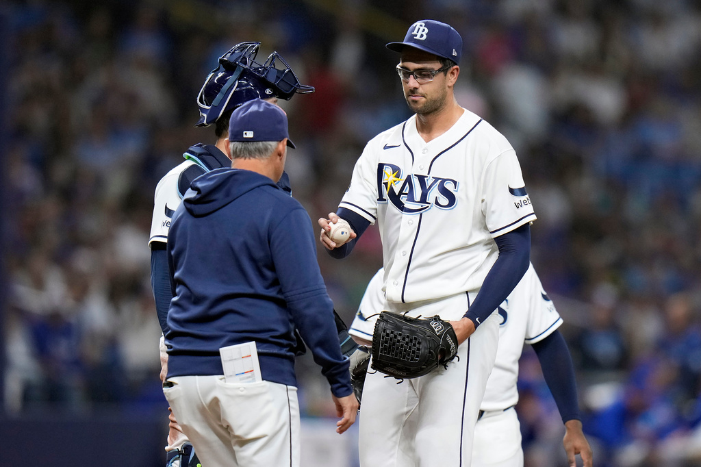 Tampa Bay Rays pitcher Joe Boyle, right, hands the ball to manager Kevin Cash as he is taken out of the game against the Chicago Cubs during the fifth inning of a baseball game Wednesday, April 8, 2026, in St. Petersburg, Fla. (AP Photo/Chris O'Meara)