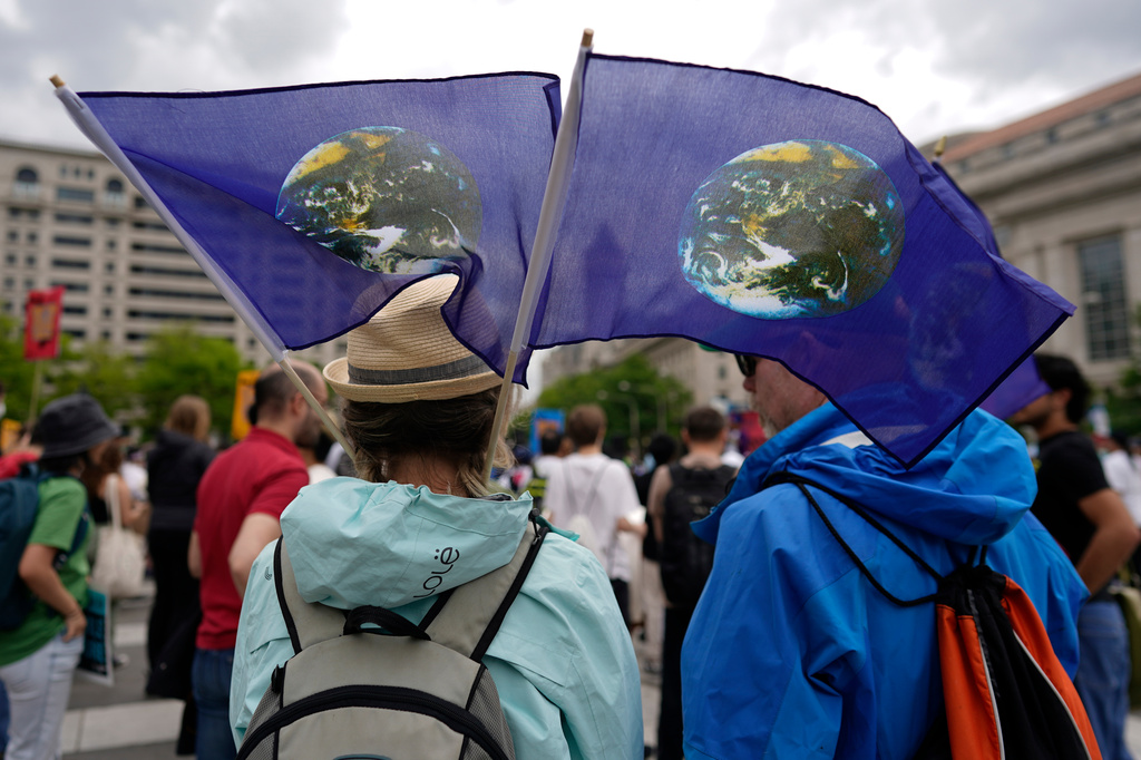 FILE - Climate activists hold a rally to protest the use of fossil fuels on Earth Day at Freedom Plaza, April 22, 2023, in Washington. (AP Photo/Carolyn Kaster, File)
