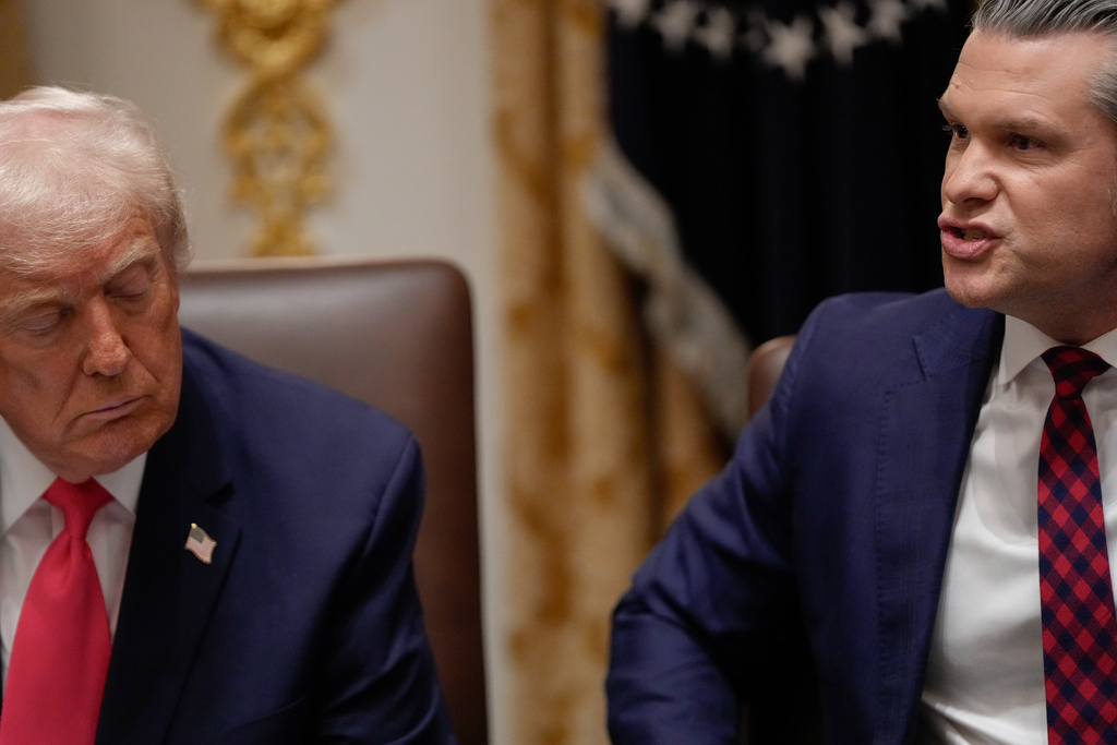 President Donald Trump closes his eyes as Defense Secretary Pete Hegseth speaks during a Cabinet meeting at the White House, Tuesday, Dec. 2, 2025, in Washington. (AP Photo/Julia Demaree Nikhinson)