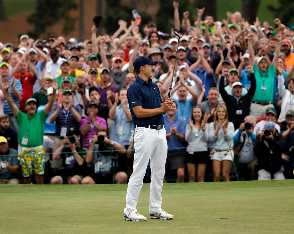 FILE - Jordan Spieth celebrates after winning the Masters golf tournament on April 12, 2015, in Augusta, Ga. (AP Photo/Matt Slocum, File)