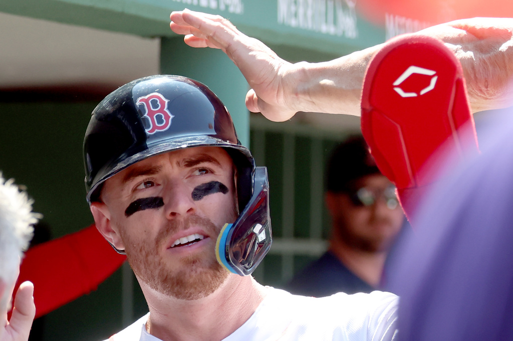 Boston Red Sox's Caleb Durbin reacts in the dugout after scroing a run during the sixth inning of the first baseball game of a doubleheader against the Tampa Bay Rays, Friday, July 17, 2026, in Boston. (AP Photo/Mark Stockwell)