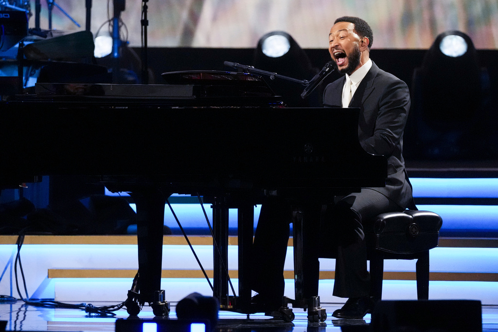 FILE - John Legend performs 'Hero' during MusiCares Person of the Year honoring Mariah Carey on Jan. 30, 2026, in Los Angeles. (AP Photo/Chris Pizzello, File)