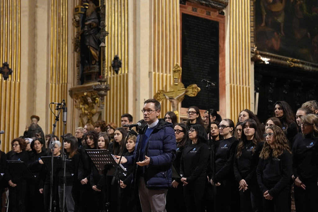 The Rev. Stefano Guidi, head of the Archdiocese of Milan’s Service for Oratories and Sport, addresses attendees during a concert at the church of Sant’Antonio Abate in Milan, Italy, on Feb. 18, 2026. (AP Photo/María Teresa Hernández)