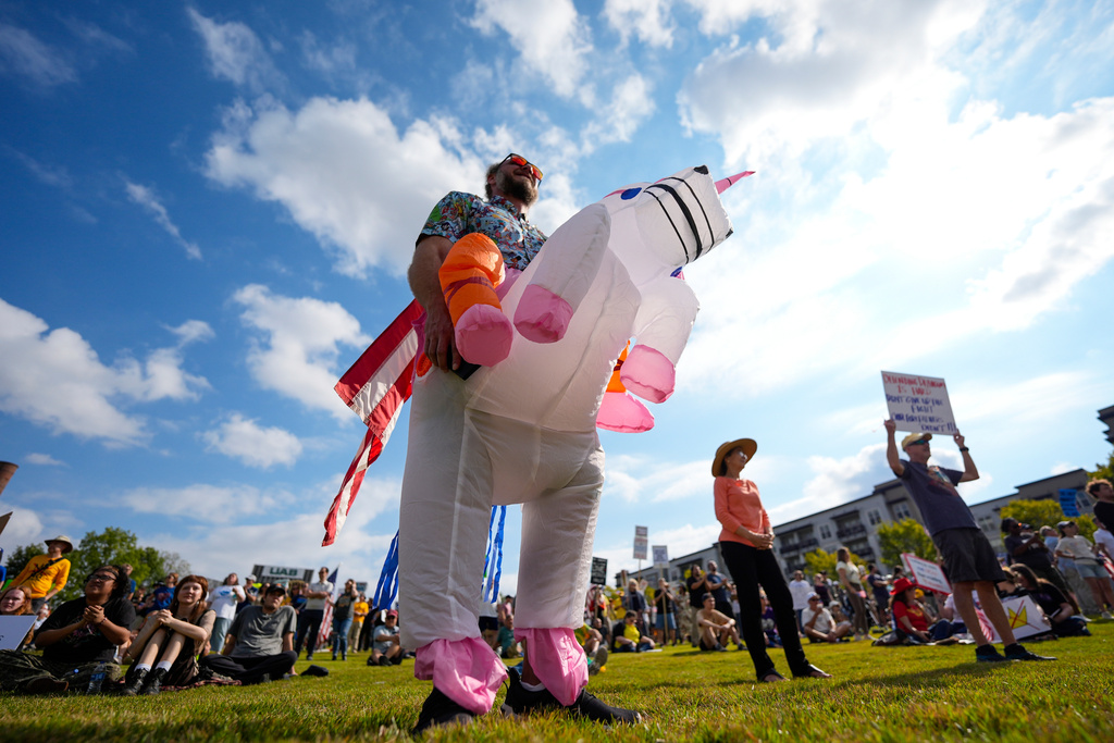 Matt Ezell participates in a "No Kings" rally, Saturday, Oct. 18, 2025, in Birmingham, Ala. (AP Photo/Mike Stewart)