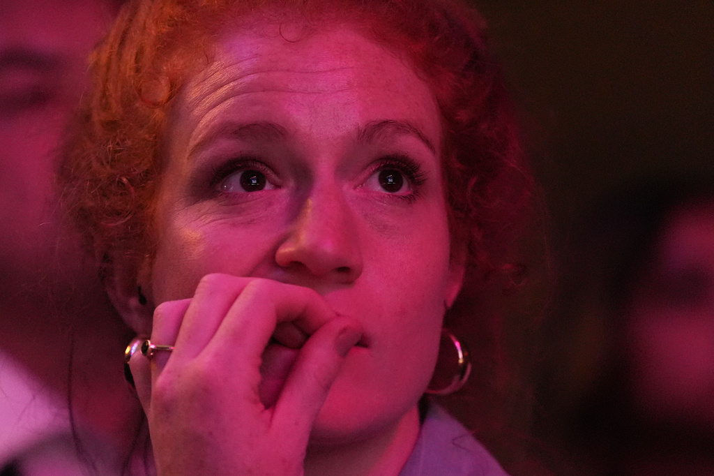 An attendee reacts to election results during a primary election night event for Abdul El-Sayed, a progressive candidate in the Democratic primary for U.S. Senate in Michigan, Wednesday, Aug. 5, 2026, at the Majestic Theatre in Detroit. (AP Photo/Julia Demaree Nikhinson)