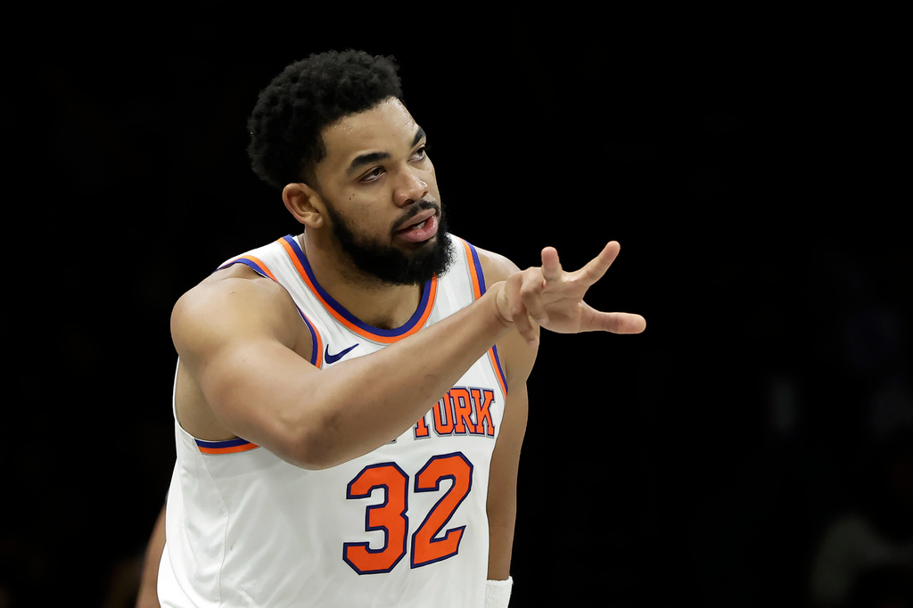 New York Knicks center Karl-Anthony Towns reacts after making a three-point basket during the second half of an NBA basketball game against the Brooklyn Nets, Monday, Nov. 24, 2025, in New York. (AP Photo/Adam Hunger)