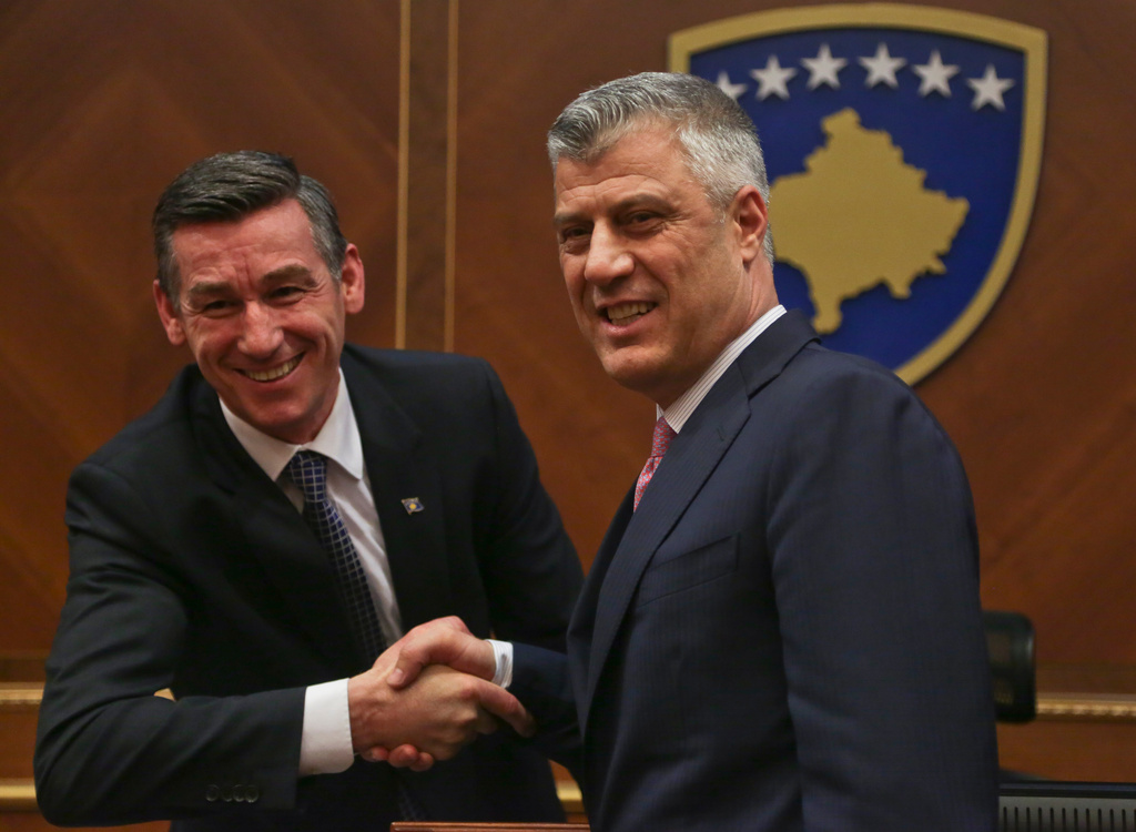 FILE - Head of Kosovo Parliament Kadri Veseli, left, congratulates newly elected president of Kosovo Hashim Thaci during a parliamentary session in Kosovo capital Pristina on Friday Feb. 26, 2016. (AP Photo/Visar Kryeziu, File)