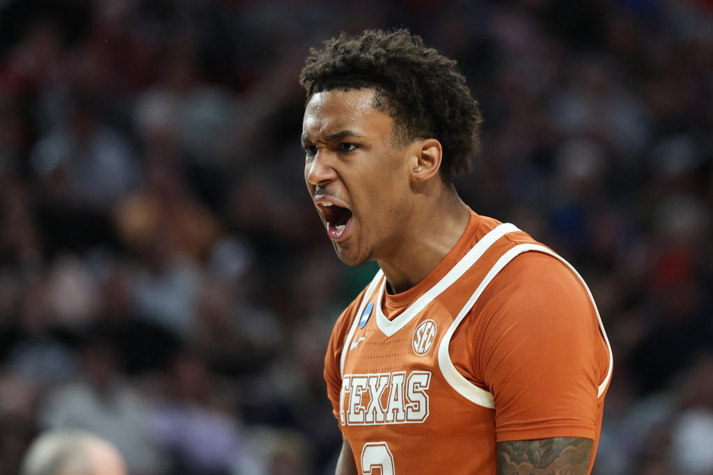 Texas forward Dailyn Swain (3) reacts during the first half in the second round of the NCAA college basketball tournament against Gonzaga, Saturday, March 21, 2026, in Portland, Ore. (AP Photo/Craig Mitchelldyer)