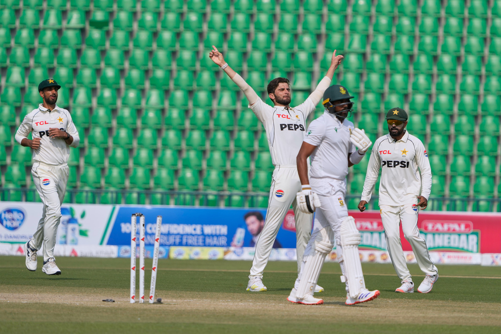 Pakistan's Shaheen Shah Afridi, center, celebrates after taking the wicket of South Africa's Prenelan Subrayen, second right, during the fourth day of the first test cricket match between Pakistan and South Africa, in Lahore, Pakistan, Wednesday, Oct. 15, 2025. (AP Photo/K.M. Chaudary)