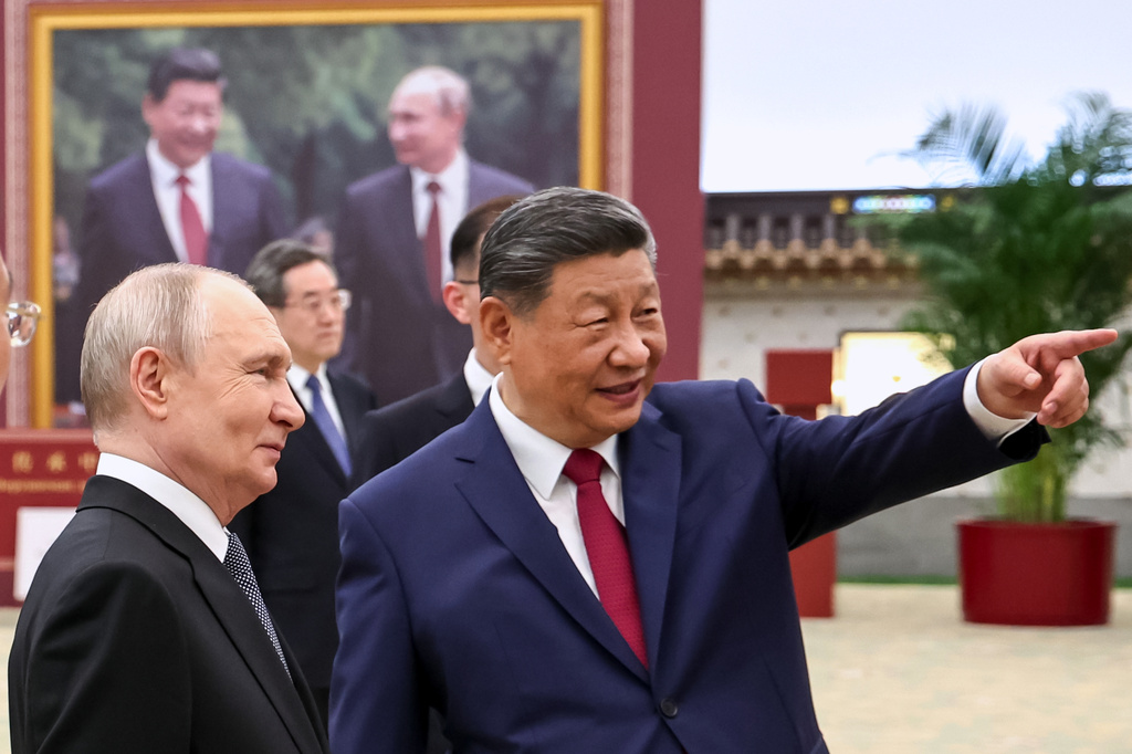 FILE - Russian President Vladimir Putin, left, and Chinese President Xi Jinping visit an exhibition by the TASS and Xinhua news agencies at the Great Hall of the People, in Beijing, China, May 20, 2026. (Alexander Kazakov, Sputnik, Kremlin Pool Photo via AP, File)