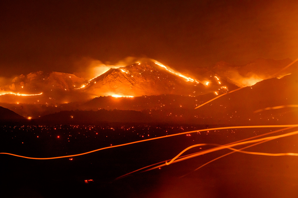 FILE - The Bug Fire burns near Doyle in unincorporated Lassen County, Calif., Aug. 13, 2026. (AP Photo/Noah Berger, File)
