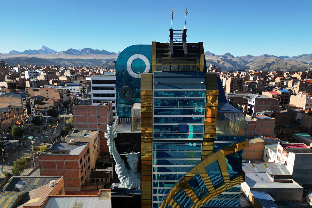 A building called Cholet is decorated with a replica of the Statue of Liberty in El Alto, Bolivia, Wednesday, June 24, 2026. (AP Photo/Juan Karita)