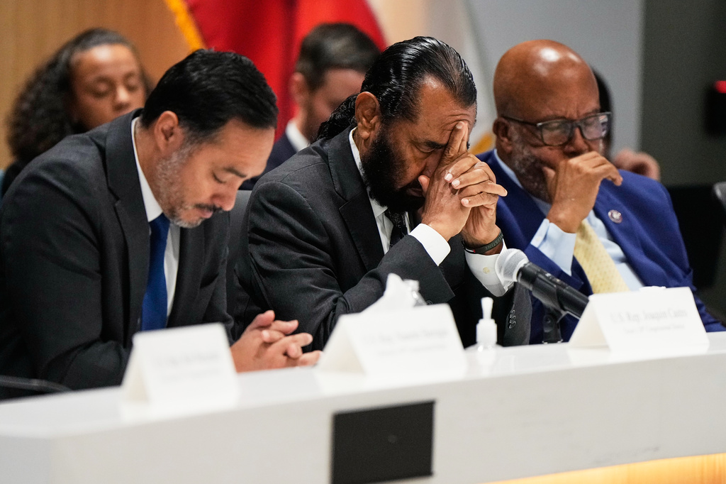 From left, Rep. Joaquin Castro, D-Texas, Rep. Al Green, D-Texas, and Rep. Bennie Thompson, D-Ala. react during an oversight forum on Friday, July 24, 2026, in Houston, about the death of Lorenzo Salgado Araujo, who was shot and killed by an ICE officer. (AP Photo/Ashley Landis)