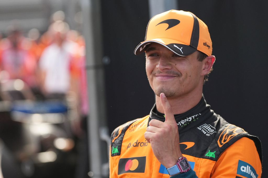McLaren driver Lando Norris of Britain celebrates after winning the qualifying session ahead of Sunday's Formula One Hungarian Grand Prix auto race, at the Hungaroring racetrack in Mogyorod, near Budapest, Hungary, Saturday, July 25, 2026. (AP Photo/Darko Vojinovic)