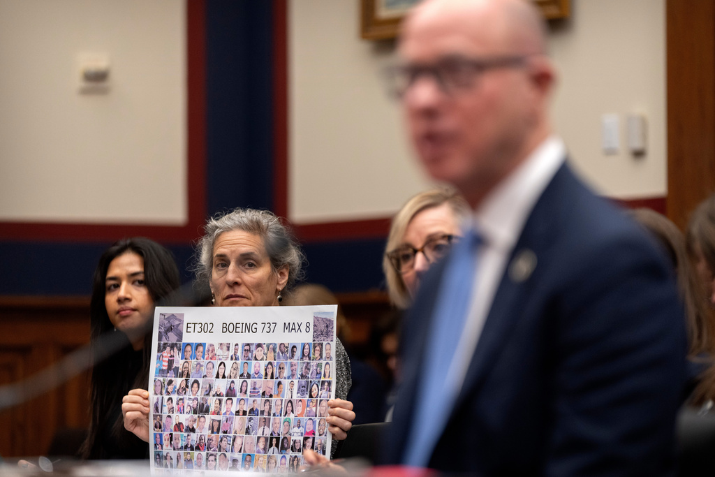 Nikita Joy of the Foundation for Aviation Safety, left, and Nadia Milleron of Sheffield, Mass., whose daughter Samya Stumo was killed in the crash of Ethiopian Airlines flight 302, listen as FAA Administrator Bryan Bedford speaks during a hearing of the Aviation Subcommittee of the House Transportation and Infrastructure Committee on Capitol Hill, Tuesday, Dec. 16, 2025, in Washington. (AP Photo/Mark Schiefelbein)