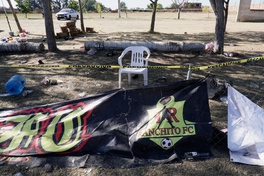 Crime scene tape surrounds a soccer field the day after gunmen opened fire, killing and wounding people, in Salamanca, Mexico, Monday, Jan. 26, 2026. (AP Photo/Mario Armas)