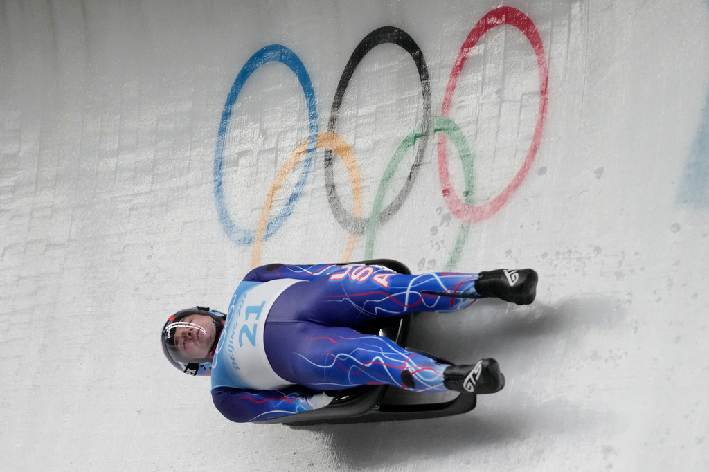 FILE - Tucker West, of United States, slides during a luge men's run at the 2022 Winter Olympics, Saturday, Feb. 5, 2022, in the Yanqing district of Beijing. (AP Photo/Mark Schiefelbein,File)