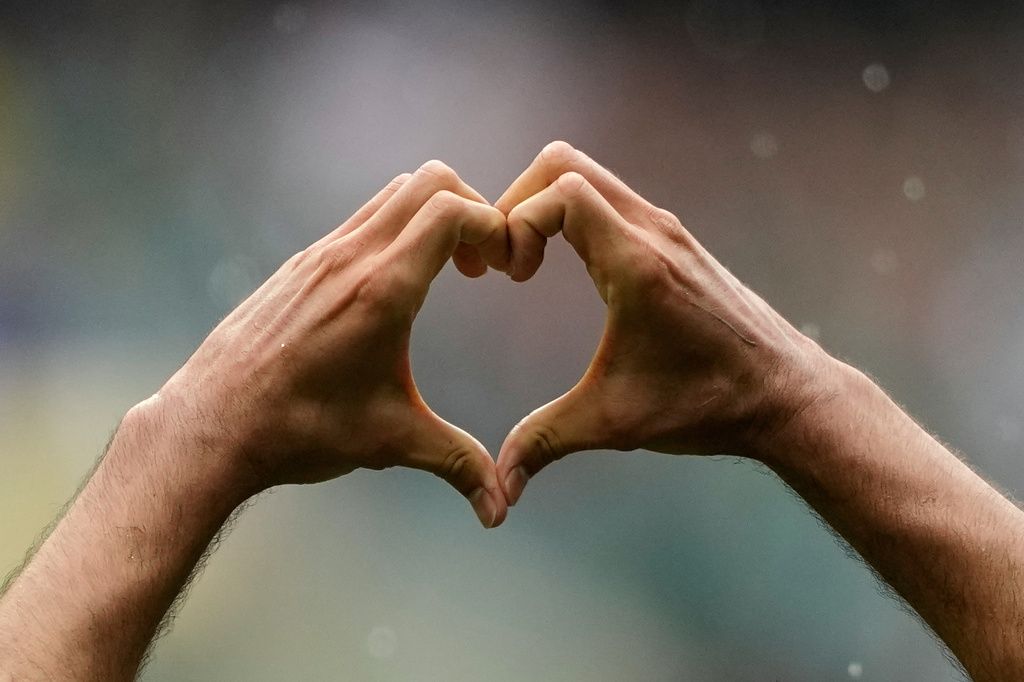Mexico's Raul Jimenez makes a heart gesture as he celebrates after scoring his side's second goal during the World Cup Group A soccer match between Mexico and South Africa in Mexico City, Thursday, June 11, 2026. (AP Photo/Natacha Pisarenko)