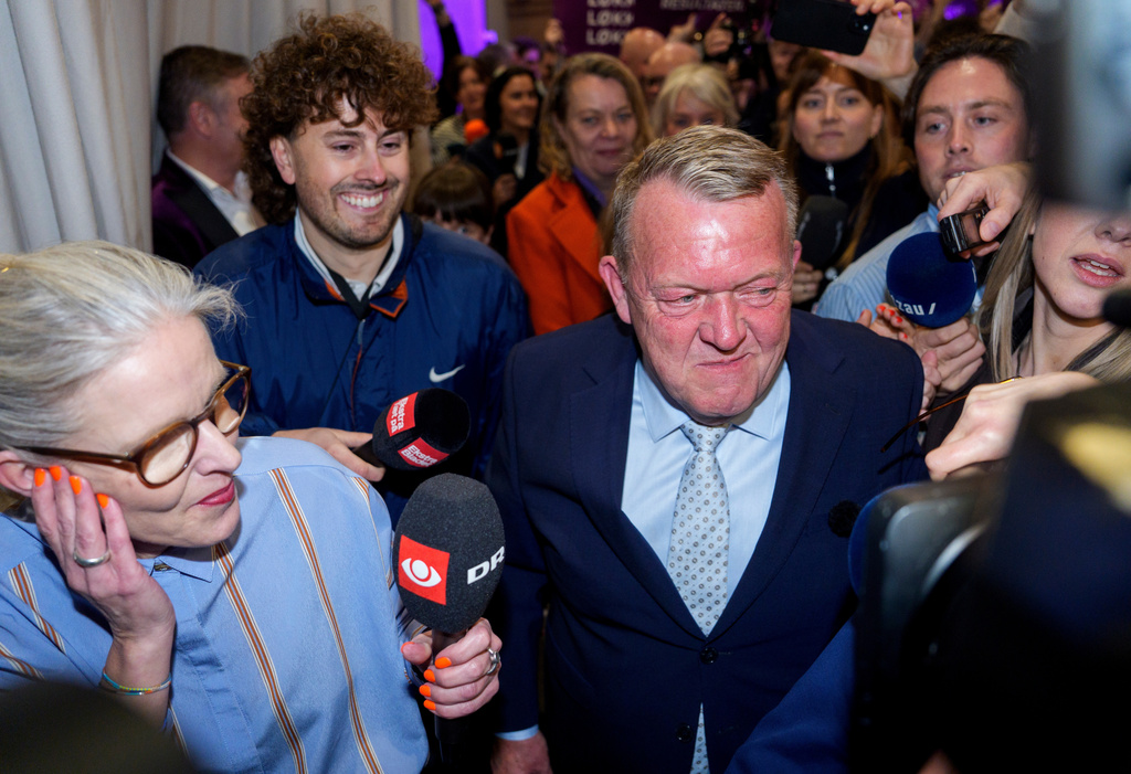 Foreign Minister Lars Løkke Rasmussen, center, leader of the Moderates, arrives at the party's election party for the 2026 Parliamentary Election at Pakhus 11, in the Oesterbro area of Copenhagen, Denmark, Tuesday, March 24, 2026. (Rasmus Flindt Pedersen/Ritzau Scanpix via AP)
