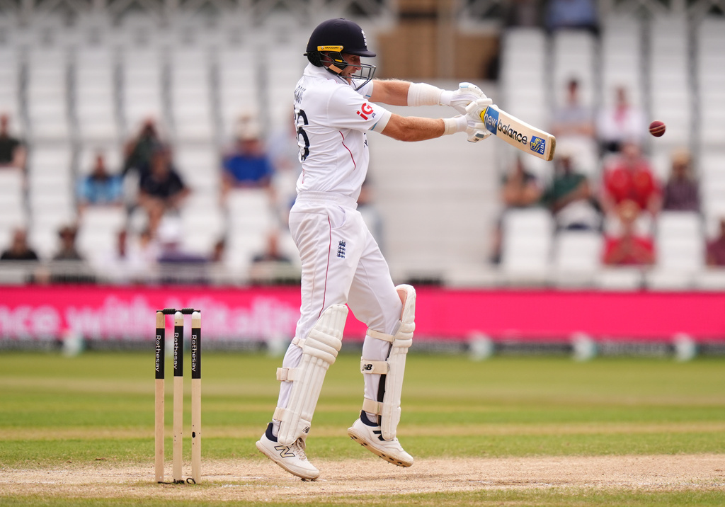 England's Joe Root hits a boundary on day five of the Third Test cricket match between England and New Zealand, in Nottingham, England, Monday, June 29, 2026. (Jacob King/PA via AP)