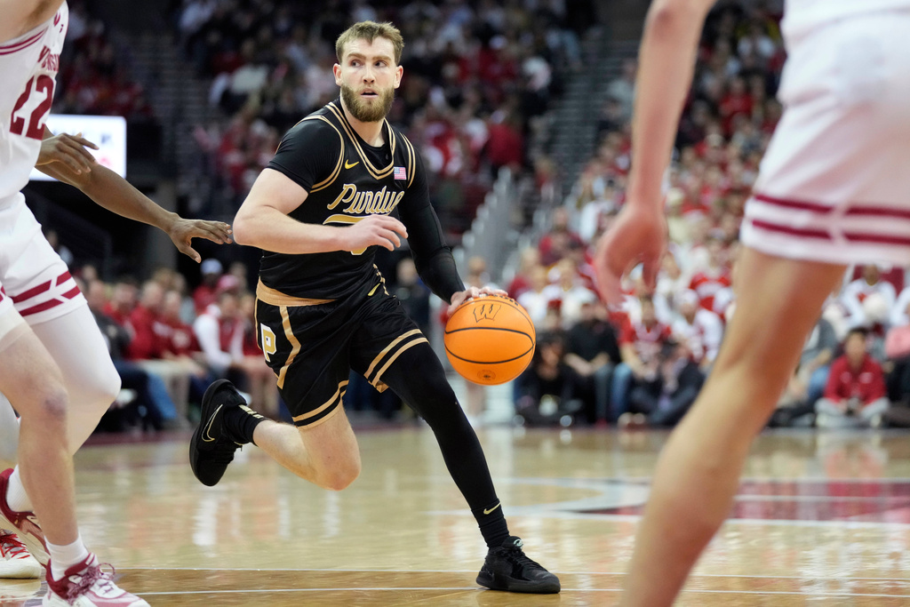 Purdue guard Braden Smith, center, dribbles during the first half of an NCAA college basketball game against Wisconsin Saturday, Jan. 3, 2026, in Madison, Wis. (AP Photo/Kayla Wolf)