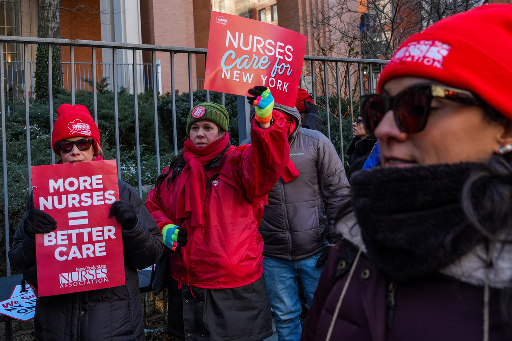 Members of the New York State Nurses Association union picket outside Mount Sinai West Hospital, Tuesday, Jan. 20, 2026, in New York. (AP Photo/Ryan Murphy)