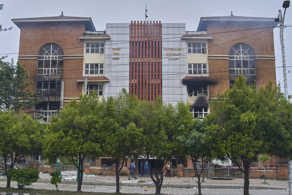 Kathmandu district court building is seen vandalized in Kathmandu, Nepal, Wednesday, Sept.10, 2025. (AP Photo/Niranjan Shrestha)