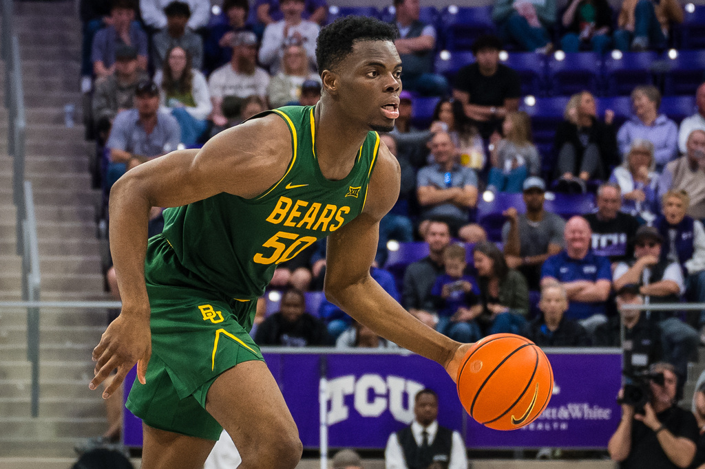 FILE - Baylor center James Nnaji dribbles the ball during an NCAA college basketball game against TCU, Saturday, Jan. 3, 2026, Fort Worth, Texas. (AP Photo/Jessica Tobias, File)