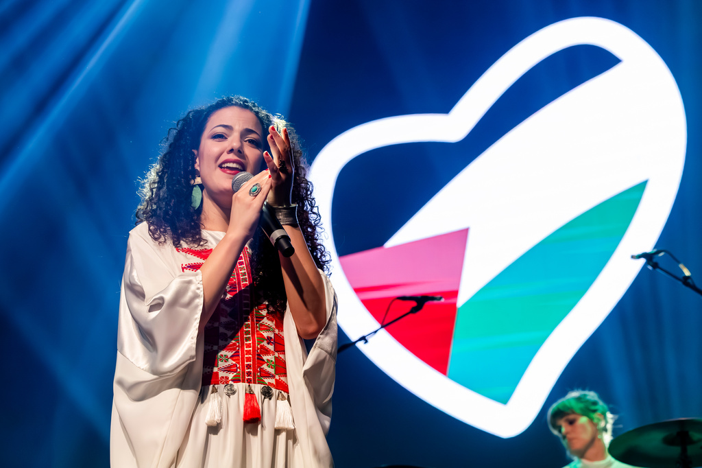 Palestinian singer-songwriter and video artis Nai Barghouti sings during a United for Palestine anti-Eurovision concert in Brussels, Tuesday, May 12, 2026. (AP Photo/Geert Vanden Wijngaert)