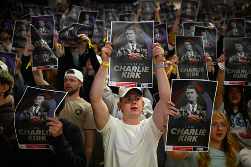 People hold posters of Charlie Kirk during a Turning Point USA rally at Utah State University, as a part of the organization's push to memorialize Kirk, Tuesday, Sept. 30, 2025, in Logan, Utah. (AP Photo/Alex Goodlett) People hold posters of Charlie Kirk during a Turning Point USA rally at Utah State University, as a part of the organization's push to memorialize Kirk, Tuesday, Sept. 30, 2025, in Logan, Utah. (AP Photo/Alex Goodlett)
