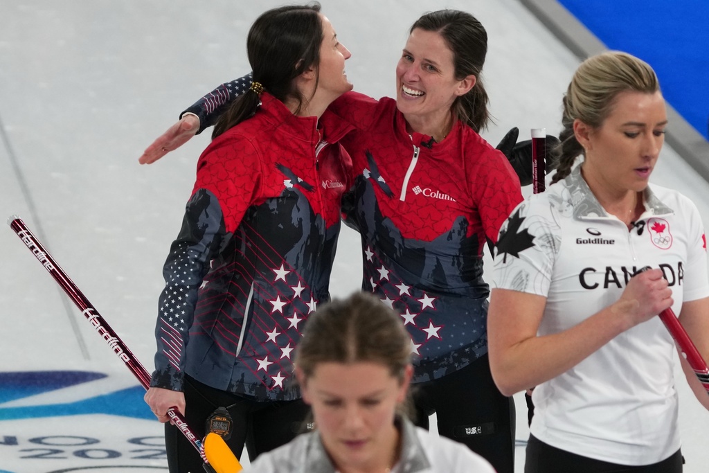 United States' Tabitha Peterson, and Tara Peterson react after the women's curling round robin session against Canada, at the 2026 Winter Olympics, in Cortina d'Ampezzo, Italy, Friday, Feb. 13, 2026. (AP Photo/Misper Apawu)