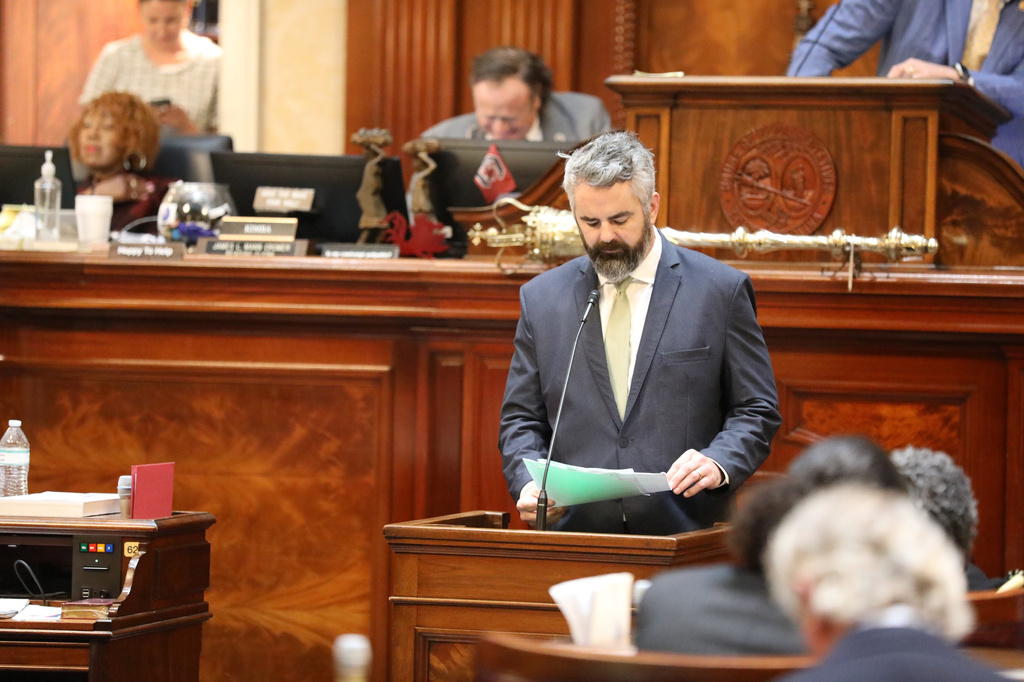Republican South Carolina Rep. Micah Caskey reads a resolution limiting debate during the House session on redistricting on Monday, May 18, 2026, in Columbia, S.C. (AP Photo/Jeffrey Collins)