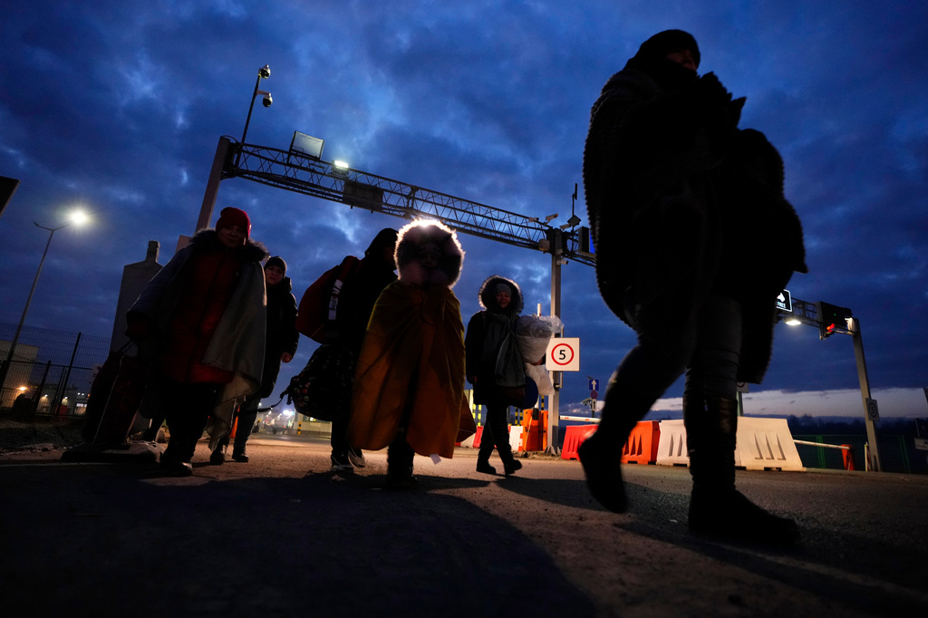 FILE - Refugees fleeing the conflict in neighboring Ukraine arrive to in Przemysl, Poland, Sunday, Feb. 27, 2022. (AP Photo/Petr David Josek, File)