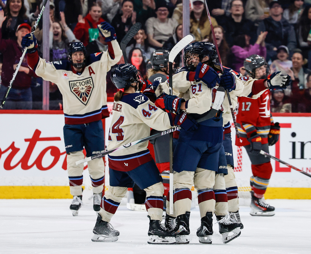 Montreal Victoire's Nicole Gosling (61) celebrates her goal against the Ottawa Charge during second period PWHL action in Winnipeg, Sunday, March 22, 2026. (John Woods/The Canadian Press via AP)