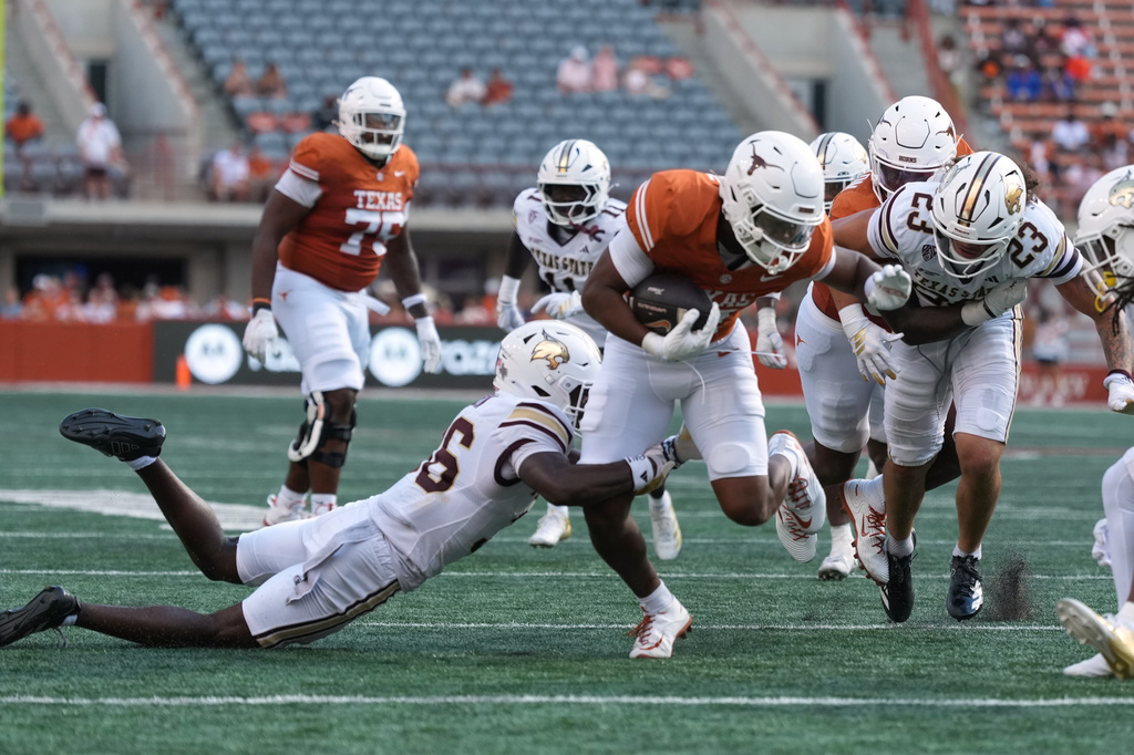 Texas running back James Simon (31) runs against Texas State during the second half of an NCAA college football game in Austin, Texas, Saturday, Sept. 5, 2026. (AP Photo/Eric Gay)