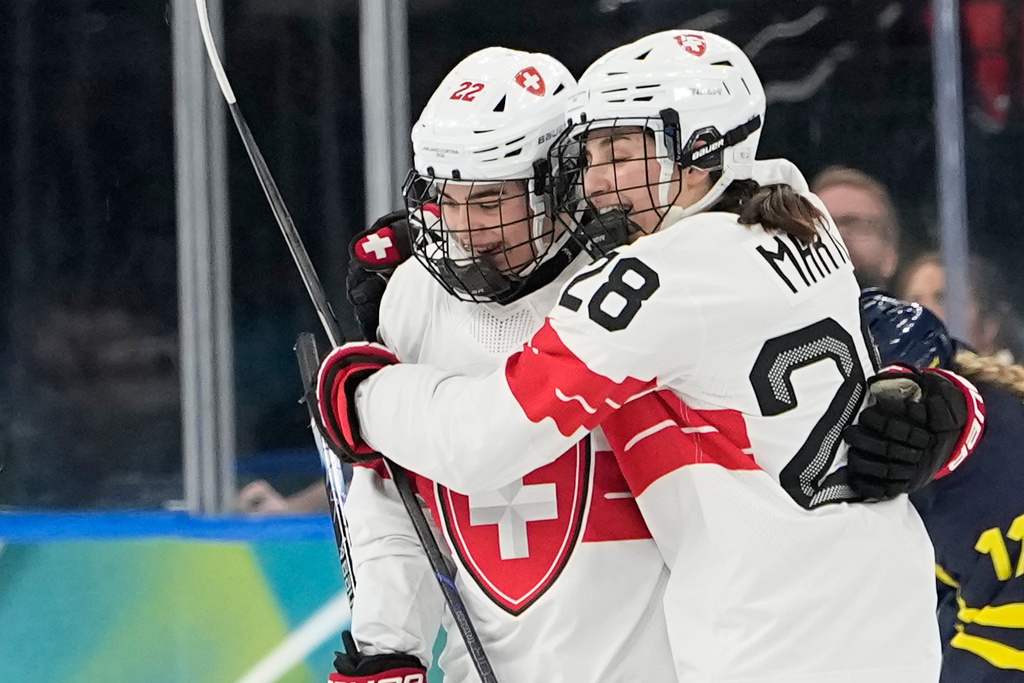 Switzerland's Sinja Leemann (22) celebrates after scoring her side's opening goal during a women's ice hockey bronze medal game between Switzerland and Sweden at the 2026 Winter Olympics, in Milan, Italy, Thursday, Feb. 19, 2026. (AP Photo/Hassan Ammar)