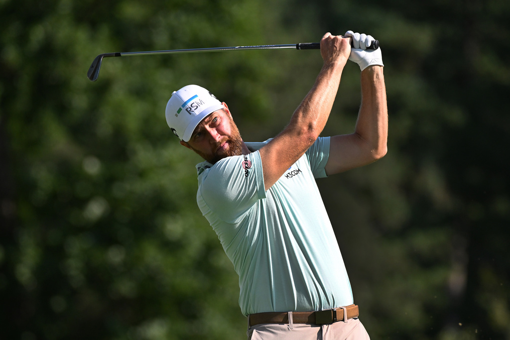 Chris Kirk hits from the ninth tee during the first round of the Rocket Classic golf tournament at the Detroit Golf Club, Thursday, July 30, 2026, in Detroit. (AP Photo/Jose Juarez)